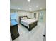 Bright bedroom with neutral colors and ensuite bathroom at 9151 Bay Dr, Spring Hill, FL 34606