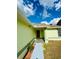 Home front entrance featuring a front door with a storm door at 9151 Bay Dr, Spring Hill, FL 34606