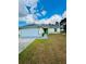 Charming single-story home with a well-manicured lawn and attached two-car garage at 9151 Bay Dr, Spring Hill, FL 34606