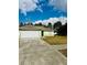 Charming single-story home with a two-car garage, set on a well-manicured front lawn at 9151 Bay Dr, Spring Hill, FL 34606