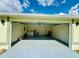 Spacious garage with laundry, new paint, and epoxy floor at 9151 Bay Dr, Spring Hill, FL 34606
