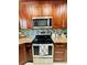 Modern kitchen featuring stainless steel appliances, granite countertops, and sleek backsplash at 9151 Bay Dr, Spring Hill, FL 34606