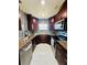 Kitchen with stainless steel appliances, granite countertops and modern backsplash at 9151 Bay Dr, Spring Hill, FL 34606