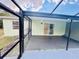Relaxing screened patio, perfect for outdoor living and dining in a private setting at 9151 Bay Dr, Spring Hill, FL 34606