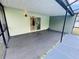 View of a large screened in patio with sliding glass doors leading to the interior of the home at 9151 Bay Dr, Spring Hill, FL 34606