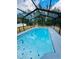 This screened-in pool is perfect for relaxation and enjoyment at 9151 Bay Dr, Spring Hill, FL 34606