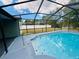 This screened-in pool offers a refreshing escape and adds value to this outdoor oasis at 9151 Bay Dr, Spring Hill, FL 34606