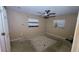 Empty bedroom with a ceiling fan and two bright windows at 5109 19Th W St, Bradenton, FL 34207