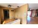 An entryway featuring laminate floors, a built-in shelf, and an open view to an adjacent living room at 5109 19Th W St, Bradenton, FL 34207