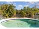 Backyard pool with stairs, surrounded by a white fence and landscaping at 5109 19Th W St, Bradenton, FL 34207