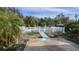 Backyard pool surrounded by a white fence and lush landscaping at 5109 19Th W St, Bradenton, FL 34207