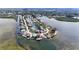 Beautiful aerial shot of a coastal community with waterfront homes, showcasing its unique layout and access to water at 6417 Driftwood Dr, Hudson, FL 34667