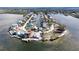 Stunning aerial view of waterfront community homes featuring private docks and waterfront access at 6417 Driftwood Dr, Hudson, FL 34667