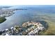 A stunning aerial view of a waterfront community, highlighting the coastal lifestyle at 6417 Driftwood Dr, Hudson, FL 34667