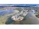 Breathtaking aerial view of waterfront homes with private docks on the bay and canals at 6417 Driftwood Dr, Hudson, FL 34667