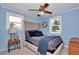 Bedroom with blue walls, neutral carpet, and water view at 6417 Driftwood Dr, Hudson, FL 34667