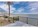 Seaside deck featuring iron railings and serene water views at 6417 Driftwood Dr, Hudson, FL 34667