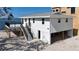Waterfront house featuring an elevated deck with stairs leading to the ground level and water views at 6417 Driftwood Dr, Hudson, FL 34667