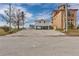 Beautiful beach house with parking and outdoor amenities next to another larger home at 6417 Driftwood Dr, Hudson, FL 34667