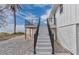 Exterior shot of waterfront home featuring deck with stairs and gravel landscaping at 6417 Driftwood Dr, Hudson, FL 34667