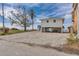 Beautiful beach house with parking and outdoor amenities next to another larger home at 6417 Driftwood Dr, Hudson, FL 34667