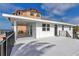 Exterior view of waterfront home featuring a deck with water views and outdoor living space at 6417 Driftwood Dr, Hudson, FL 34667