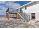 Exterior view of waterfront home featuring a deck, stairs, and ground level parking at 6417 Driftwood Dr, Hudson, FL 34667