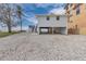 Beautiful beach house with parking and outdoor amenities next to another larger home at 6417 Driftwood Dr, Hudson, FL 34667