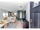 Open-concept living room with water views, a plush sofa, and stylish decor for relaxation and entertainment at 6417 Driftwood Dr, Hudson, FL 34667