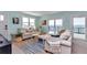 Inviting living room with water views, comfortable seating and natural light at 6417 Driftwood Dr, Hudson, FL 34667