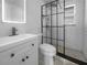 Modern bathroom with white subway tile shower, updated vanity and stylish fixtures at 913 27Th E St, Bradenton, FL 34208