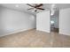 Neutral-toned empty room with tile floors and ceiling fan ready for personalization at 913 27Th E St, Bradenton, FL 34208