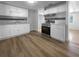 Well-lit kitchen featuring white cabinetry, marble counters, and modern stainless steel appliances at 913 27Th E St, Bradenton, FL 34208