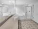 Bathroom featuring granite counters, ceramic tile floors, bathtub, and a shower with glass doors at 4903 Rambling Rose Pl, Tampa, FL 33624