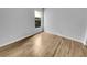 Bedroom featuring hardwood floors, neutral paint, and a window providing natural light at 4903 Rambling Rose Pl, Tampa, FL 33624