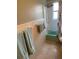 Bathroom featuring a tub, white tile, and light blue towels on the wall at 814 20Th Sw St, Largo, FL 33770