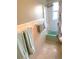 Bathroom featuring a tub, white tile, and light blue towels on the wall at 814 20Th Sw St, Largo, FL 33770