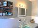 Cozy bathroom featuring decorative baskets and subway tile backsplash at 814 20Th Sw St, Largo, FL 33770