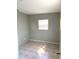 Bedroom with tile flooring, a window with blinds, and light-colored walls at 814 20Th Sw St, Largo, FL 33770