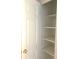 Open white closet with multiple shelves for organization and storage at 814 20Th Sw St, Largo, FL 33770