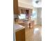 Well-lit kitchen area featuring classic wooden cabinetry and durable laminate countertops at 814 20Th Sw St, Largo, FL 33770