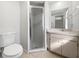 Well-maintained bathroom with a glass-enclosed shower and neutral-toned vanity at 507 Circlewood Dr # O2, Venice, FL 34293