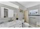 Modern bathroom featuring a sleek marble vanity and tiled shower at 5350 47Th N Ave, St Petersburg, FL 33709