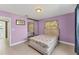 Cozy bedroom with a large closet and lavender walls at 5350 47Th N Ave, St Petersburg, FL 33709