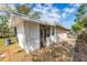 The home's back exterior features a screened porch, patio, and grassy yard for outdoor enjoyment at 5350 47Th N Ave, St Petersburg, FL 33709