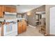 Bright kitchen with tile floors and backsplash provides ample counter space for culinary adventures and Gathering gatherings at 5350 47Th N Ave, St Petersburg, FL 33709