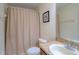 Bathroom with a shower curtain and granite counters at 10917 Brickside Ct, Riverview, FL 33579