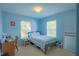 Comfortable bedroom with natural light, carpeted floor, and a desk at 10917 Brickside Ct, Riverview, FL 33579