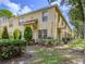 Charming townhouse featuring a well-manicured lawn and inviting facade at 10917 Brickside Ct, Riverview, FL 33579