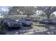 A view of the front of the house, showing the cars parked in the driveway at 1814 Elk Ave, Sarasota, FL 34235